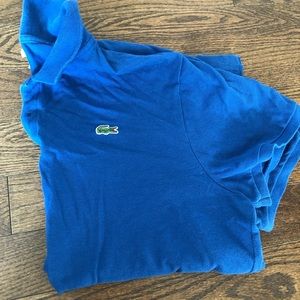 Blue Lacoste polo shirt.